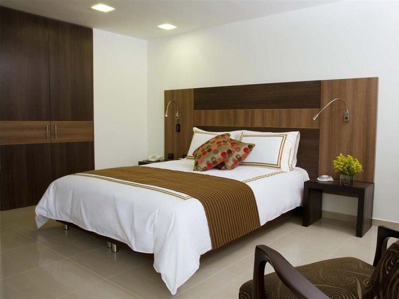 San Simon Hotel Pereira By Soratama Kültér fotó A bedroom