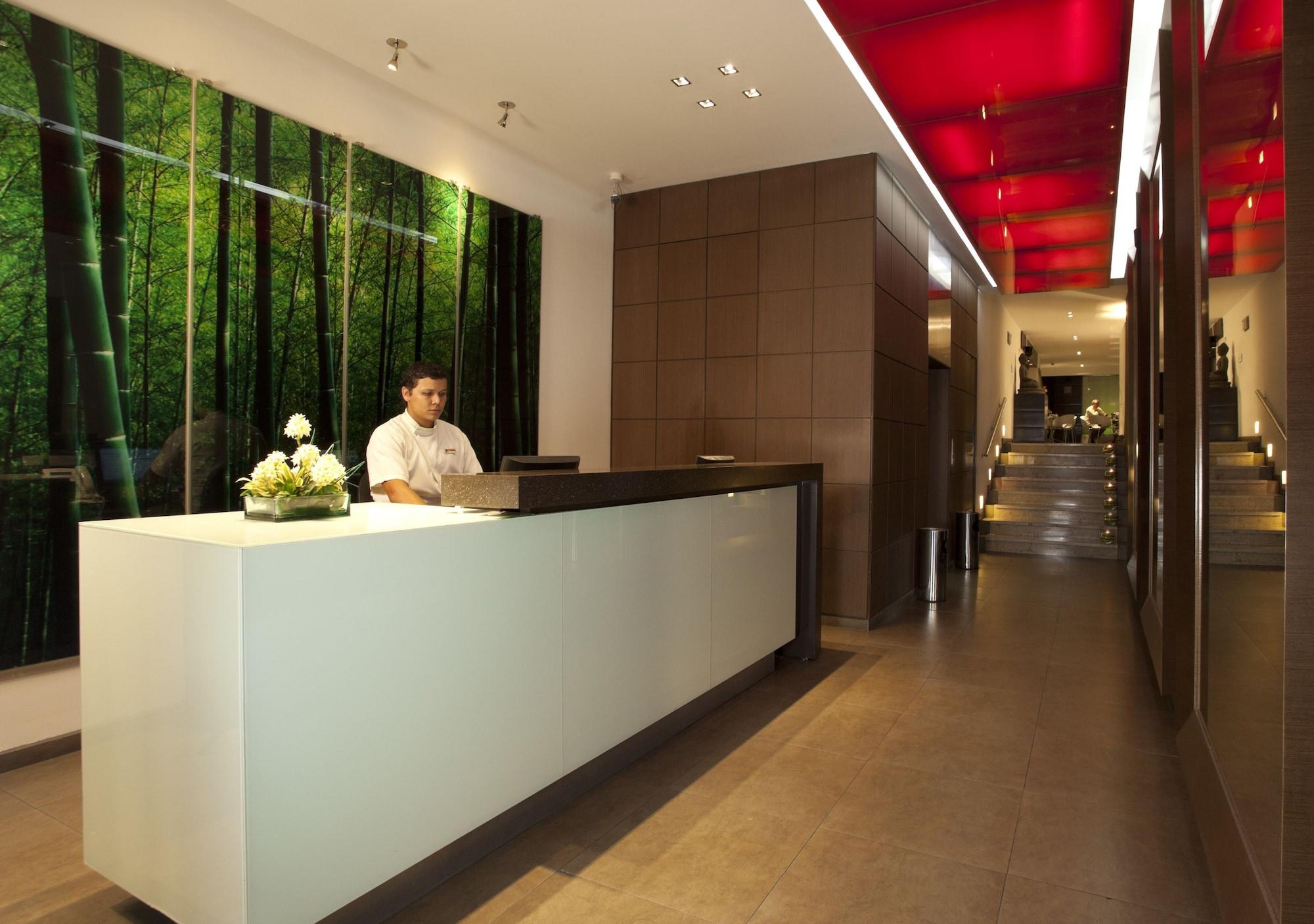 San Simon Hotel Pereira By Soratama Kültér fotó The reception area of the hotel