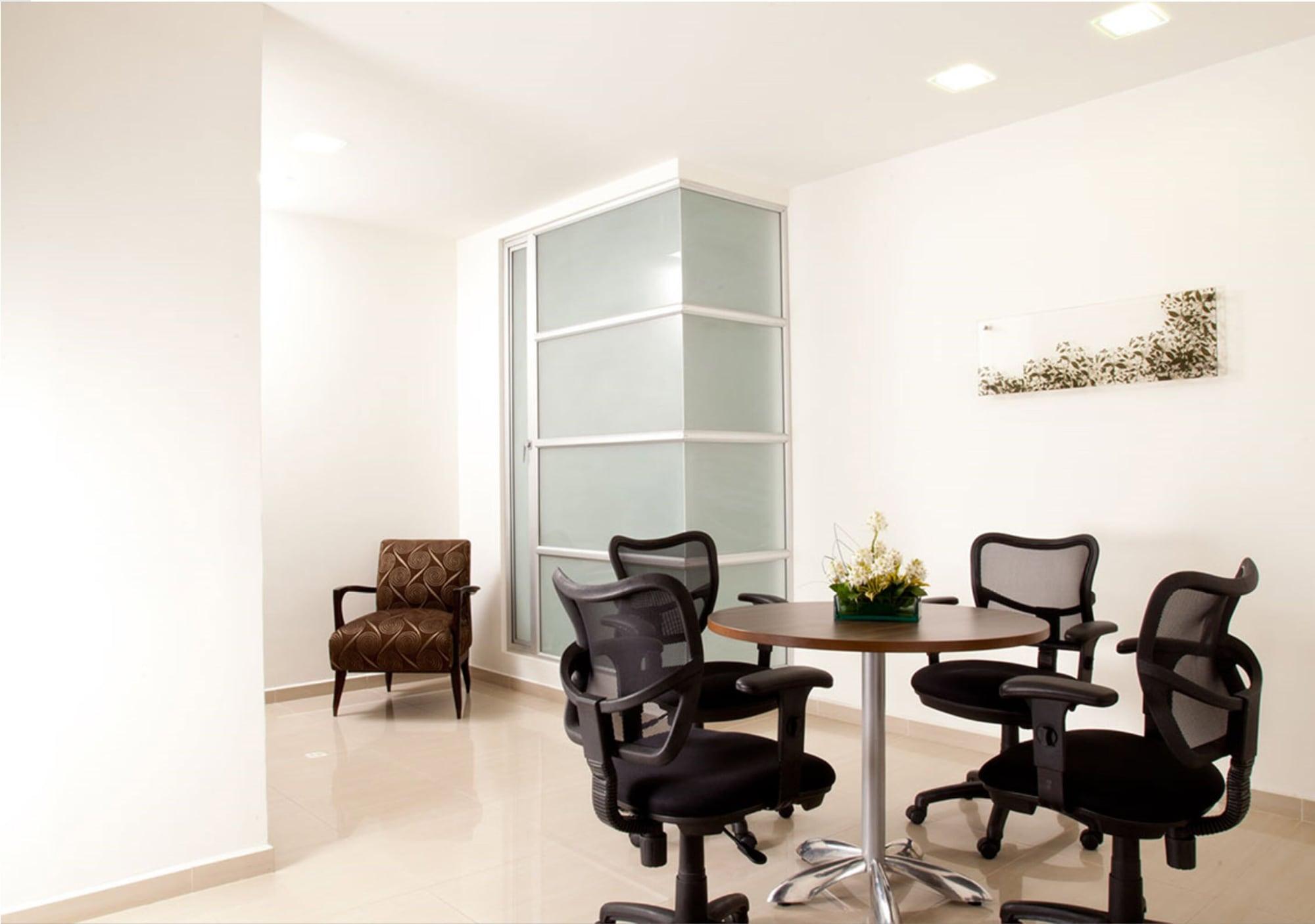San Simon Hotel Pereira By Soratama Kültér fotó A typical office