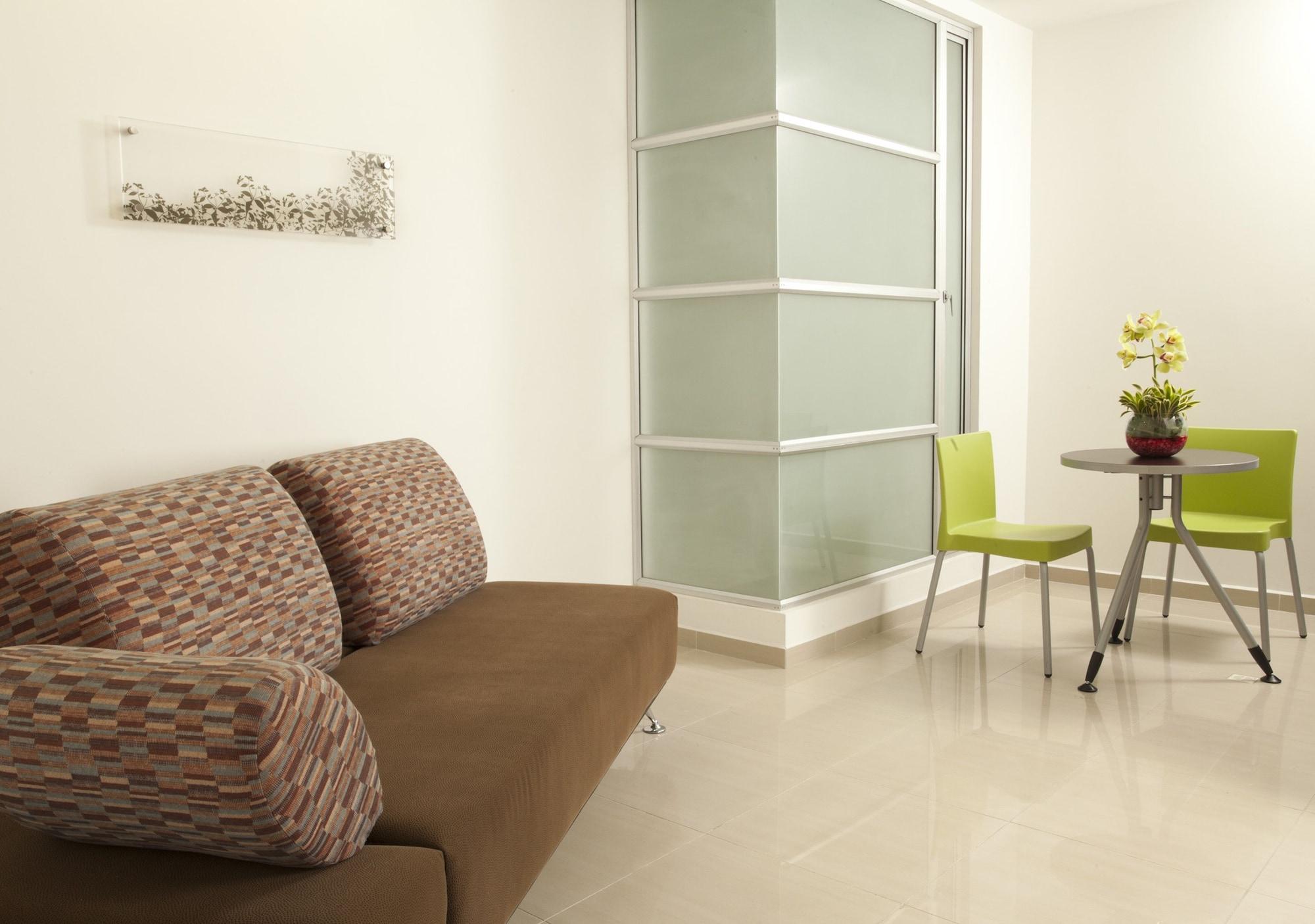 San Simon Hotel Pereira By Soratama Kültér fotó A room with a vinyl floor